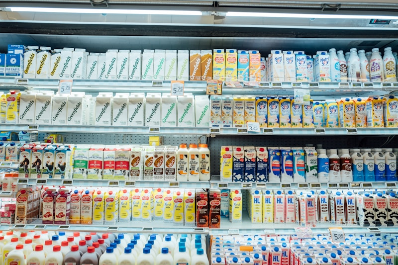 Dairy products including milk and yogurt in refrigerated shelves